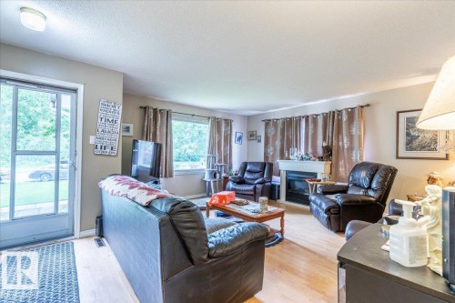 5116 52 St, Warburg, AB - Indoor Photo Showing Living Room With Fireplace