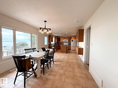 Dining room featuring a chandelier, light tile patterned floors, and recessed lighting - A15 Wicks Street, Rural Leduc County, AB - Indoor Photo Showing Dining Room
