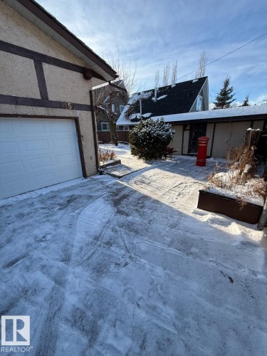 View of home's exterior featuring stucco siding - A15 Wicks Street, Rural Leduc County, AB - Outdoor