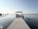 Dock area featuring a water view - A15 Wicks Street, Rural Leduc County, AB  - Outdoor With Body Of Water With View 