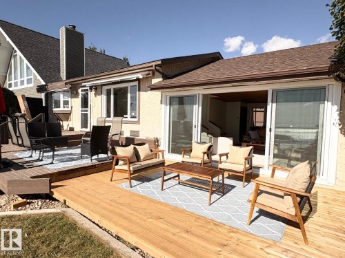 Wooden terrace featuring an outdoor living space - A15 Wicks Street, Rural Leduc County, AB - Outdoor With Deck Patio Veranda With Exterior