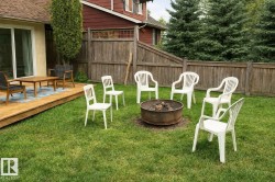 View of yard featuring a fire pit and a deck - 