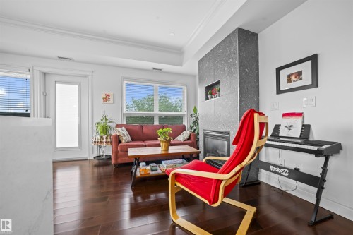 405 10232 115 St Nw, Edmonton, AB - Indoor Photo Showing Living Room With Fireplace