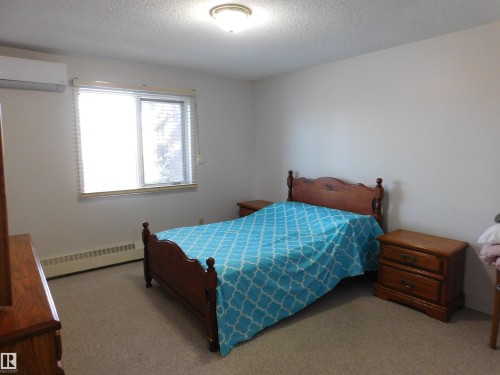 210 10945 21 Avenue, Edmonton, AB - Indoor Photo Showing Bedroom