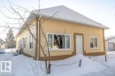 Snow covered back of property with stucco siding - 4813 52 Ave, St. Paul Town, AB  - Outdoor 