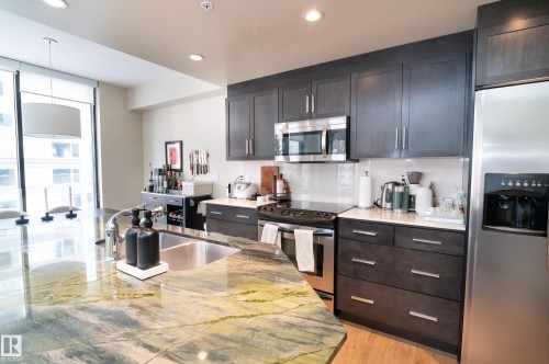 304 11933 Jasper Avenue, Edmonton, AB - Indoor Photo Showing Kitchen With Double Sink With Upgraded Kitchen