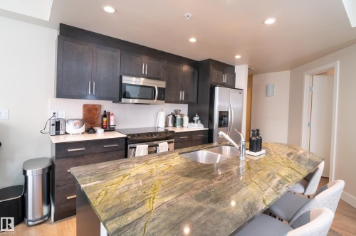 304 11933 Jasper Avenue, Edmonton, AB - Indoor Photo Showing Kitchen With Double Sink With Upgraded Kitchen
