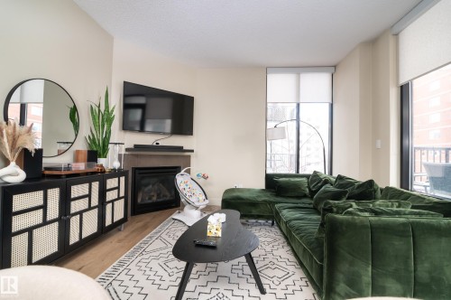 304 11933 Jasper Avenue, Edmonton, AB - Indoor Photo Showing Living Room With Fireplace