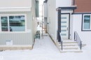 View of snow covered property entrance - 5211 104A Street Nw, Edmonton, AB  - Outdoor With Exterior 