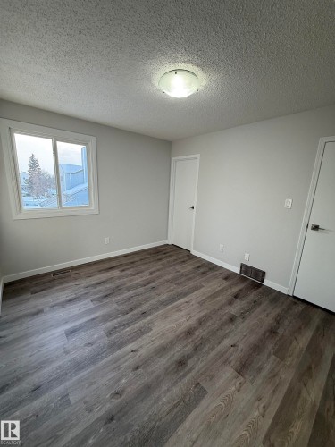 Primary Bedroom with door to ensuite - 23 Lancaster Terrace, Edmonton, AB - Indoor Photo Showing Other Room
