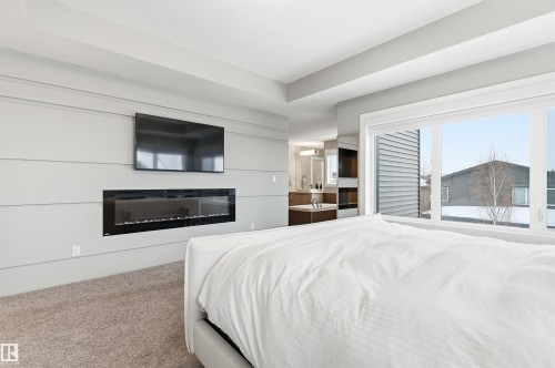 2046 Ware Road, Edmonton, AB - Indoor Photo Showing Bedroom With Fireplace