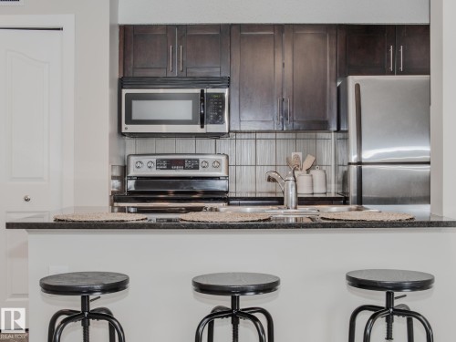 211 11803 22 Avenue, Edmonton, AB - Indoor Photo Showing Kitchen With Double Sink With Upgraded Kitchen