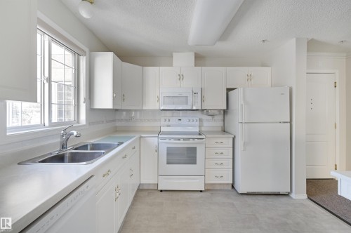 205 13450 114 Avenue, Edmonton, AB - Indoor Photo Showing Kitchen With Double Sink