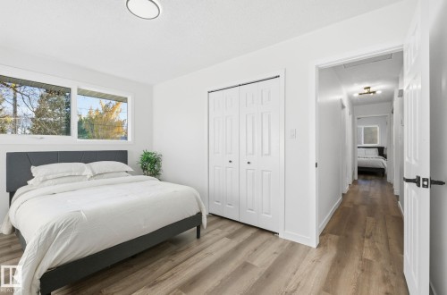 Bedroom featuring wood finished floors and a closet - 13507 124 Avenue, Edmonton, AB - Indoor Photo Showing Bedroom