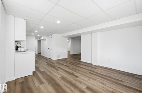 Open space between living room, dinning and kitchen in the basement. - 13507 124 Avenue, Edmonton, AB - Indoor