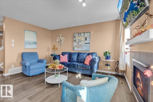 1853 28 Street, Edmonton, AB - Indoor Photo Showing Living Room With Fireplace