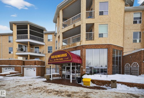 Snow covered building featuring a view of apartment building / complex - 106 15499 Castle Downs Road, Edmonton, AB - Outdoor