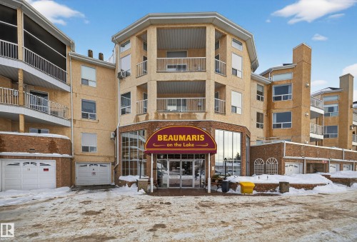 Snow covered building featuring a view of apartment building / complex - 106 15499 Castle Downs Road, Edmonton, AB - Outdoor With Facade