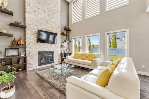 5503 Poirier Way, Beaumont, AB - Indoor Photo Showing Living Room With Fireplace