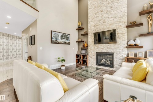 5503 Poirier Way, Beaumont, AB - Indoor Photo Showing Living Room With Fireplace