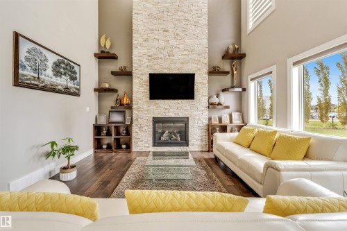 5503 Poirier Way, Beaumont, AB - Indoor Photo Showing Living Room With Fireplace