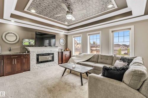 5503 Poirier Way, Beaumont, AB - Indoor Photo Showing Living Room With Fireplace