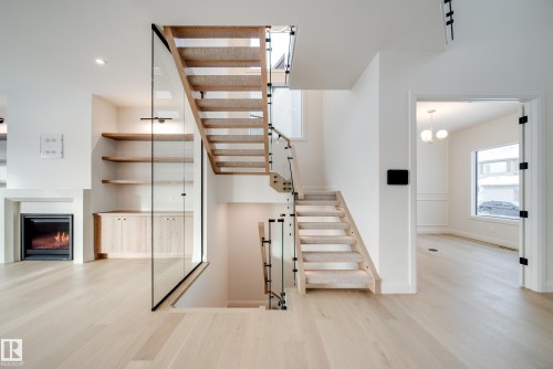 5605 Cautley Cove Cove, Edmonton, AB - Indoor Photo Showing Other Room With Fireplace