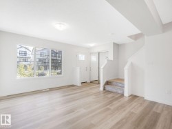 Entryway featuring stairs and light wood-style flooring - 