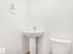 Bathroom with toilet and baseboards - 