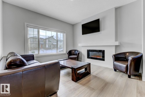 6636 46 Avenue, Beaumont, AB - Indoor Photo Showing Living Room With Fireplace
