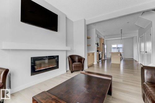 6636 46 Avenue, Beaumont, AB - Indoor Photo Showing Living Room With Fireplace