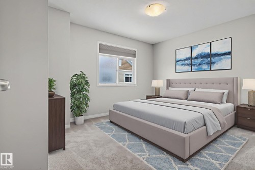 Bedroom with light colored carpet and baseboards - 60 1804 70 Street, Edmonton, AB - Indoor Photo Showing Bedroom