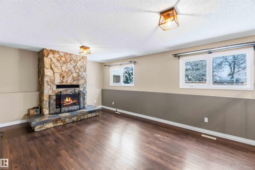 37 Devonian, Devon, AB - Indoor Photo Showing Living Room With Fireplace