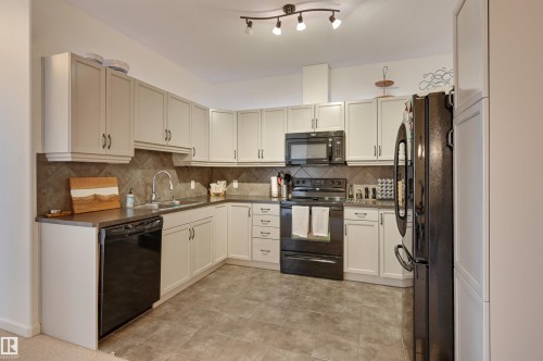 221 6083 Maynard Way, Edmonton, AB - Indoor Photo Showing Kitchen