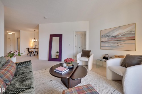 221 6083 Maynard Way, Edmonton, AB - Indoor Photo Showing Living Room