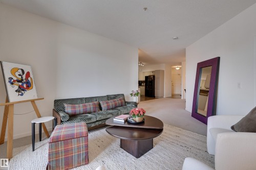 221 6083 Maynard Way, Edmonton, AB - Indoor Photo Showing Living Room