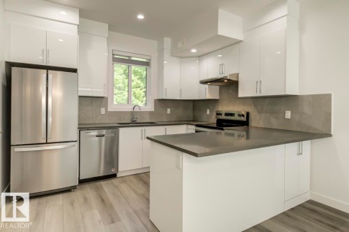101 10751 85 Avenue, Edmonton, AB - Indoor Photo Showing Kitchen With Stainless Steel Kitchen With Upgraded Kitchen