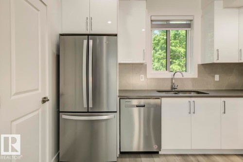 101 10751 85 Avenue, Edmonton, AB - Indoor Photo Showing Kitchen With Stainless Steel Kitchen With Double Sink