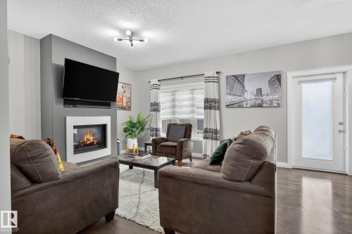 618 Adams Way, Edmonton, AB - Indoor Photo Showing Living Room With Fireplace