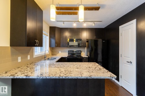 14 9515 160 Avenue, Edmonton, AB - Indoor Photo Showing Kitchen With Double Sink