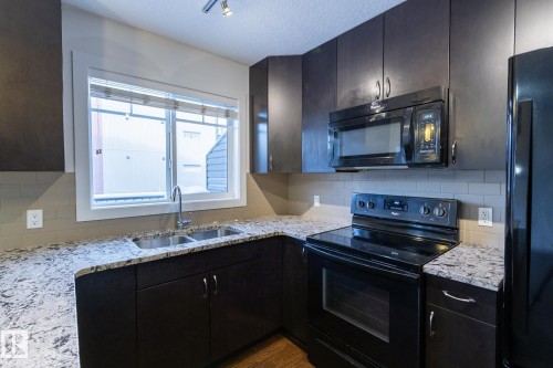 14 9515 160 Avenue, Edmonton, AB - Indoor Photo Showing Kitchen With Double Sink