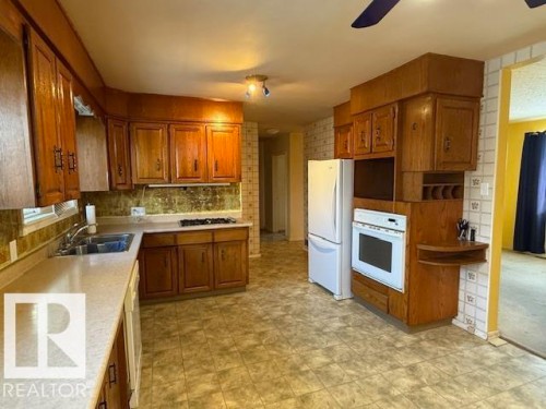 7712 Argyll Road, Edmonton, AB - Indoor Photo Showing Kitchen With Double Sink