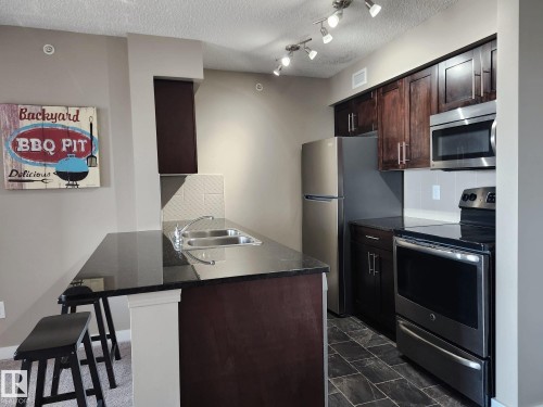 407 270 Mcconachie Drive, Edmonton, AB - Indoor Photo Showing Kitchen With Stainless Steel Kitchen With Double Sink