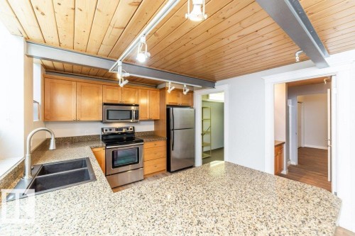 208 10009 102 Avenue, Edmonton, AB - Indoor Photo Showing Kitchen With Stainless Steel Kitchen With Double Sink