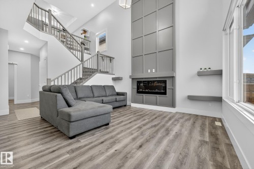 86 Meadowlink Common, Spruce Grove, AB - Indoor Photo Showing Other Room With Fireplace