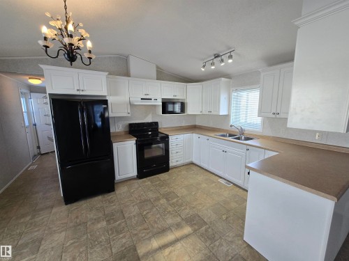 1133 Aspen Drive, Leduc, AB - Indoor Photo Showing Kitchen With Double Sink