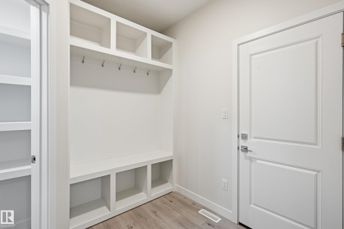 Mudroom with light wood-style floors and baseboards - 53 Patriot Way, Spruce Grove, AB - Indoor Photo Showing Other Room