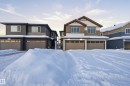 Craftsman house with an attached garage and stone siding - 53 Patriot Way, Spruce Grove, AB  - Outdoor With Facade 