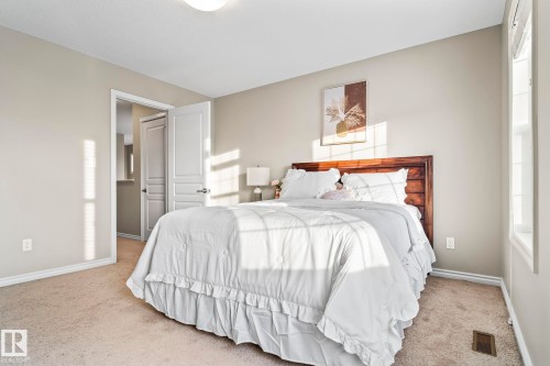 Carpeted bedroom with baseboards - 5734 175A Avenue, Edmonton, AB - Indoor Photo Showing Bedroom