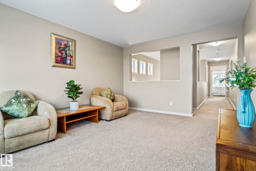 Sitting room featuring carpet, plenty of natural light, and a textured ceiling - 5734 175A Avenue, Edmonton, AB - Indoor Photo Showing Other Room